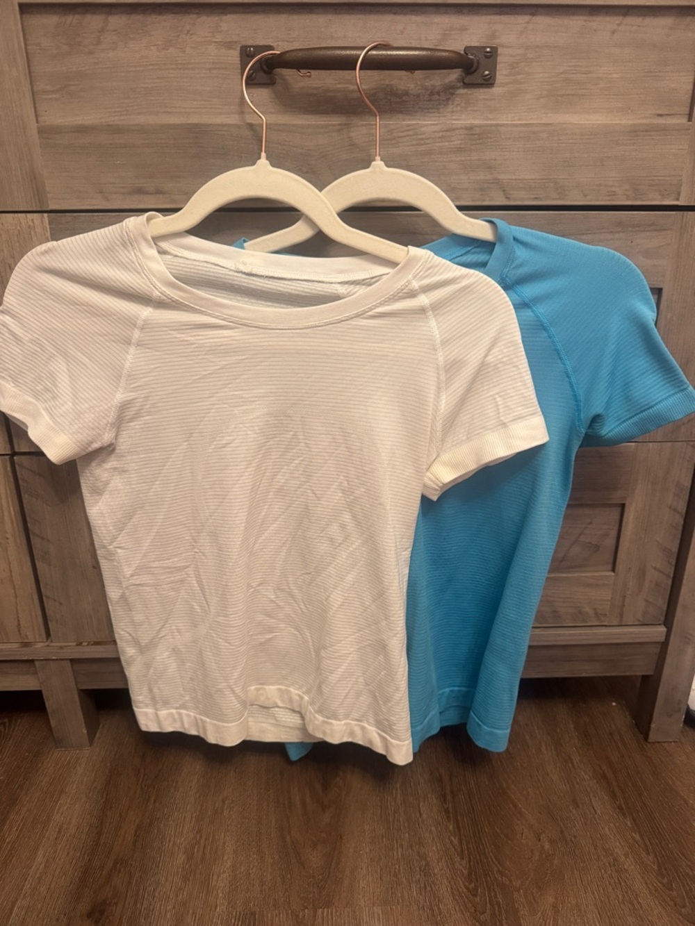 TWO waist length Lulu tops white + blue